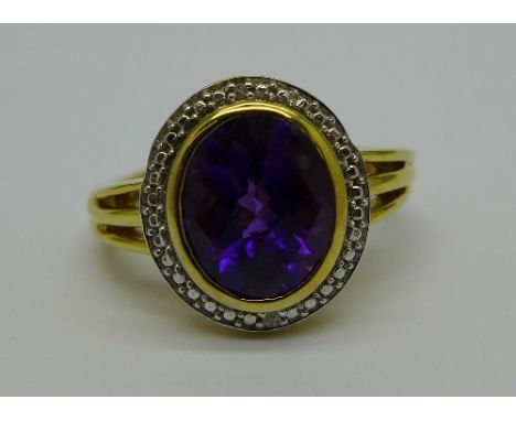 A silver gilt, amethyst and diamond ring, R