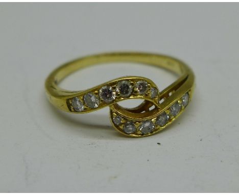 An 18ct gold and diamond crossover ring, 3.2g, Q