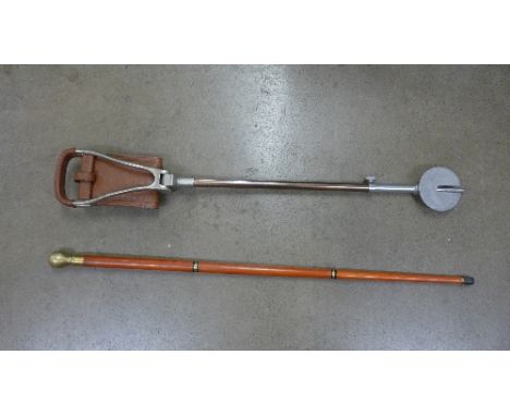 A Gamebird shooting stick and a walking cane with glass flask inside top