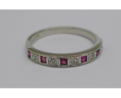 An 18ct white gold, ruby and diamond half eternity ring, 2.8g, N