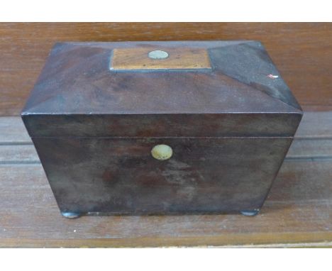 A mahogany tea caddy