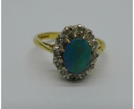An 18ct gold, opal and diamond cluster ring, 4g, M