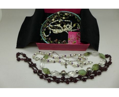 A collection of necklaces with silver fasteners including one with certificate, Pia, pearl, garnet, etc.