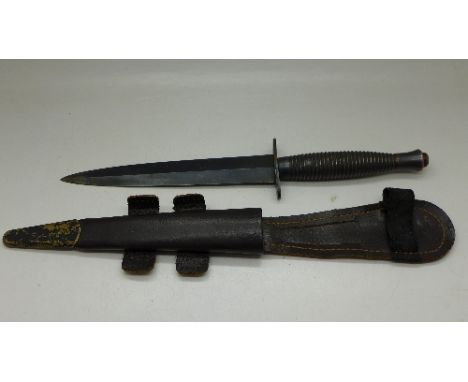 A commando dagger with scabbard, marked William Rodgers