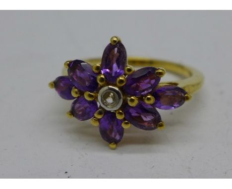 A silver gilt and amethyst floral cluster ring, M