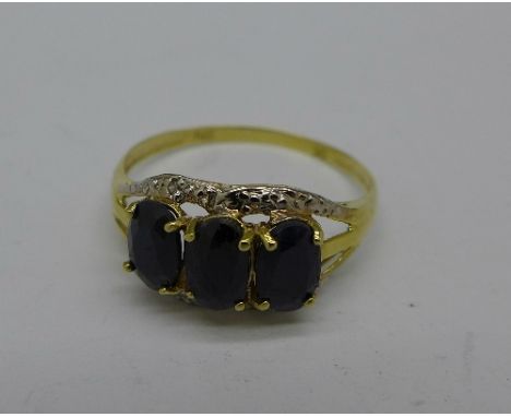 A 9ct gold, sapphire and diamond ring, 1.4g, O