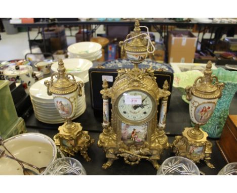 Brass & porcelain mantel clock & garnitures