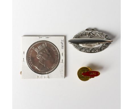 Three original Graft Zeppelin medal and badges that include one 1994 British Isle of Man commemorative Zeppelin crown with Qu