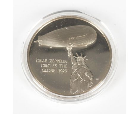 Original limited edition commemorative silver medal from the Franklin Mint: History of Flight. Features the Graf Zeppelin fly