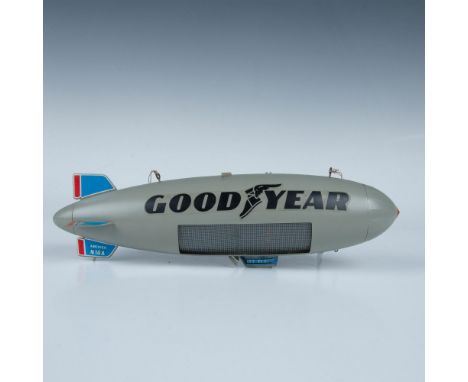 Original Goodyear blimp with a side advertising display that lights up. Features two hooks on the top with strings. Light has