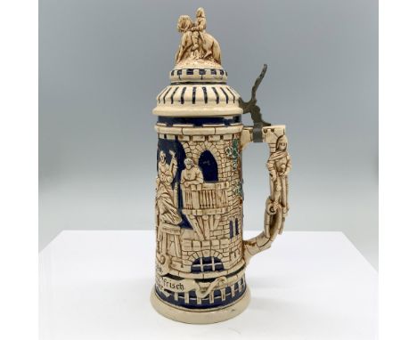 A glazed stoneware tankard with a hinged lid designed as a castle depicting a board game match between a woman and a priest a