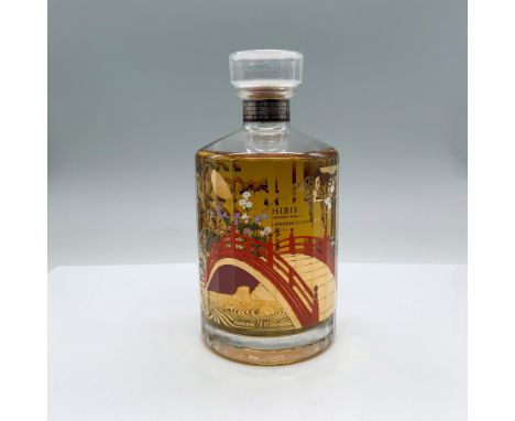 Bottle is sealed, full. This limited 100-year anniversary edition whiskey bottle pays tribute to House of Suntory's unique de