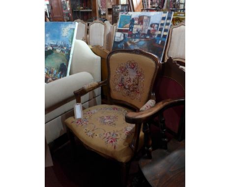 SOLD IN TIMED AUCTION A pair of French armchairs upholstered in tapestry fabric on cabriole supports 