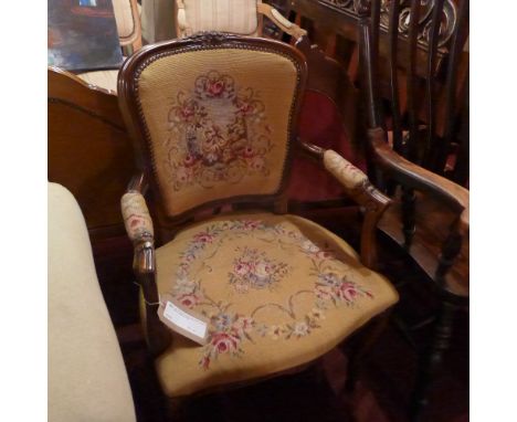SOLD IN TIMED AUCTION A pair of French armchairs upholstered in tapestry fabric on cabriole supports
