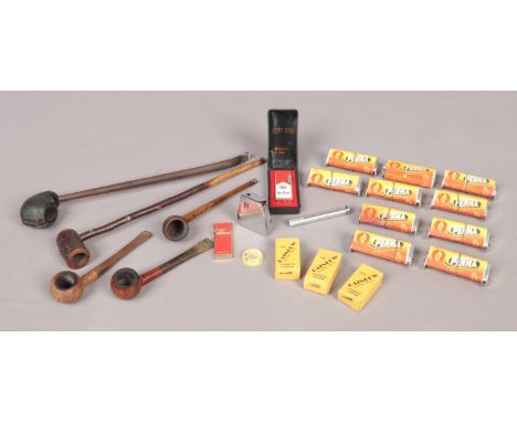 A large quantity of smoking memorabilia and accessories. To include: stem pipe, Ronson gas lighter, Perma Cigarette machines 