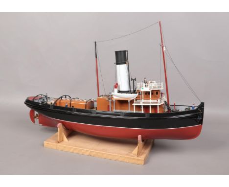 A remote control single funnel model boat on stand. L: 79cm W: 20cm.  Will need electronics fitting. No remote.