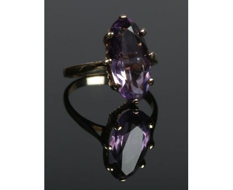 A 9ct gold ring set with a single amethyst stone. Size L. 2.91g.  