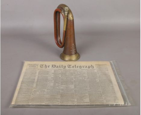 A copper bugle by R. J. Ward &amp; Sons. Dated 1914 and inscribed White Star Line.  
