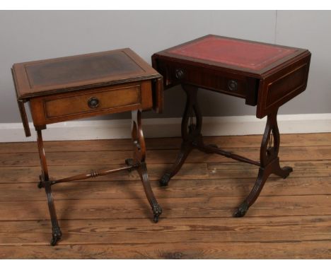 Two mahogany sofa tables, with central stretchers and lyre supports. On claw feet, raised on casters. Both examples 54.5cm hi