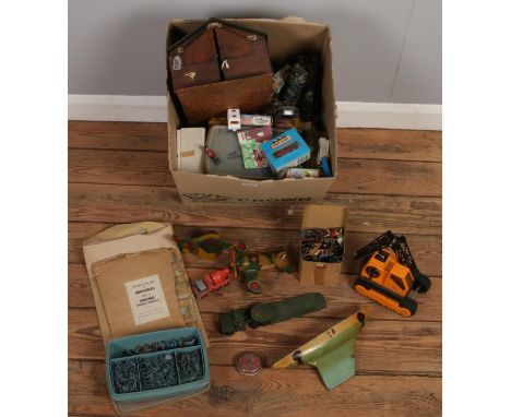 A box of vintage toys. Including Pelham puppet kit, diecast vehicles, Tonka, lead figures, etc.  