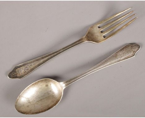 A silver fork along with a matching silver spoon. Both stamped JCHM 17 Aug 1940. 54g. Both assayed Sheffield 1939 and 1940 by