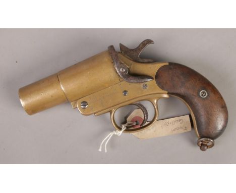 A military WWI Webley &amp; Scott flare gun. Stamped 14 baring the broad arrow mark.  Part of wooden grip missing.