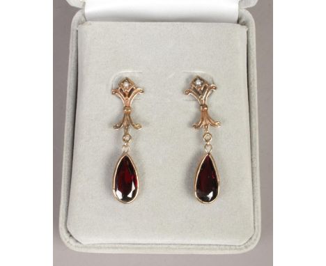 A pair of 9ct gold garnet and seed pearl drop earrings.  