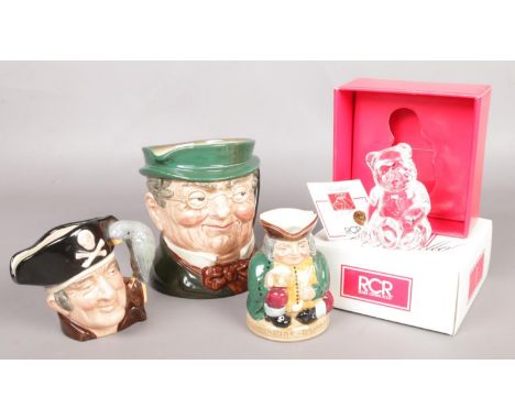 Three Royal Doulton character and toby jugs, including Mr. Pickwick and Long John Silver and a boxed Royal Crystal Rock bear 