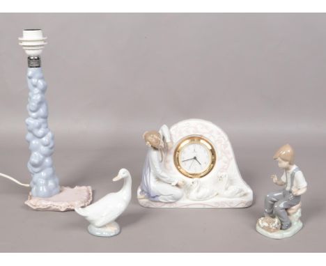 A Lladro 'Swan clock' 5777, together with NAO figures and NAO table light (missing figure).  Damage to swan clock; flower mis