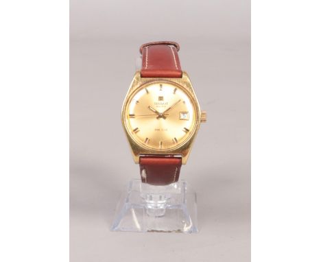 A Gentleman's Tissot PR 516 manual wind wristwatch, with gold coloured dial, baton markers and date window. On brown leather 
