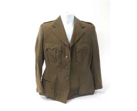 A British WW2 First Aid Nursing Yeomanry tunic (F.A.N.Y) together with a matched green skirt the tunic with F.A.N.Y badges to