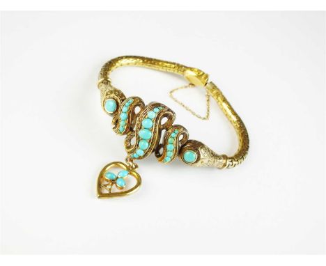 A late 19th century turquoise bracelet, designed as a central row of three graduated scrolls each set with turquoise cabochon