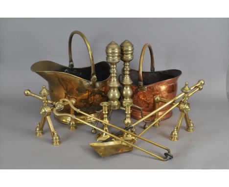 A collection of copper and brass wares to include two pairs of 19th century brass fire dogs, brass fireside tools, one brass 