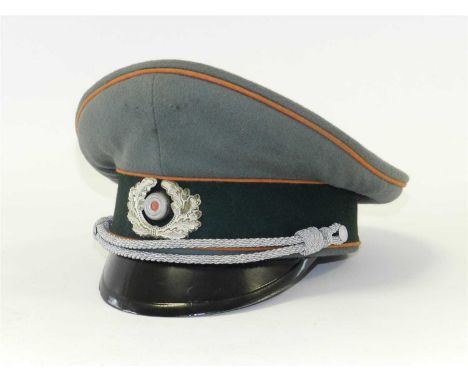 A reproduction German Third Reich Army Field Police Officer’s visor cap constructed of field grey doeskin body with a field g