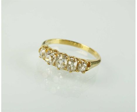 A 19th century five stone graduated diamond ring, the old mine cut diamonds claw set in yellow metal to yellow metal shank, i