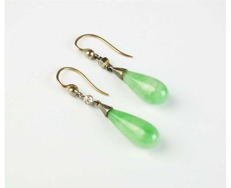 A pair of Art Deco jade and diamond ear pendants, each designed as a polished jade drop mounted with single collet set old cu