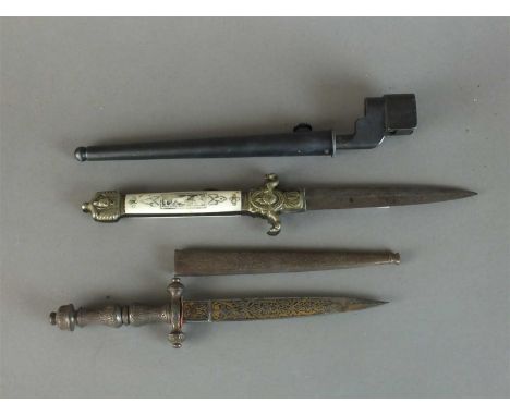 A 19th century Spanish plug bayonet, the 15cm Toledo blade decorated with panels of scrolling foliage and dated 1800, with a 