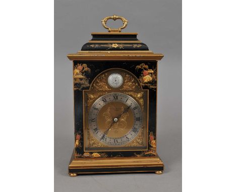 An Elliott bracket clock, in a black lacquered case with Chinoiserie decoration, the caddy top with brass swing handle, the a