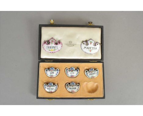 A cased set of five Crown Staffordshire porcelain decanter labels, comprising 'Gin, Port, Brandy, Whisky, Rum', each with flo