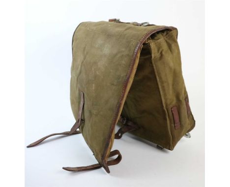 A German WWII army bag or field pack constructed of green canvas and brown leather by OTTO STEPHAN MÜHLHAUSEN and dated 1939