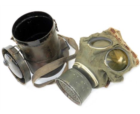 A German First World War M1917 gas mask with canister the mask of ersatz construction with all original straps and painted fi