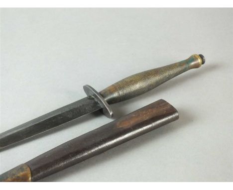 WW2 Fairbairn-Sykes Type-2 Commando Knife in leather sheath the 16.5cm blade by Wilkinson, etched 'Wilkinson Sword LTD / Lond