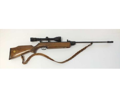 A Weihrauch HW35 .22 air rifle with Tasco 40x40 sights, chequered semi-pistol grip and sling suspension mounts