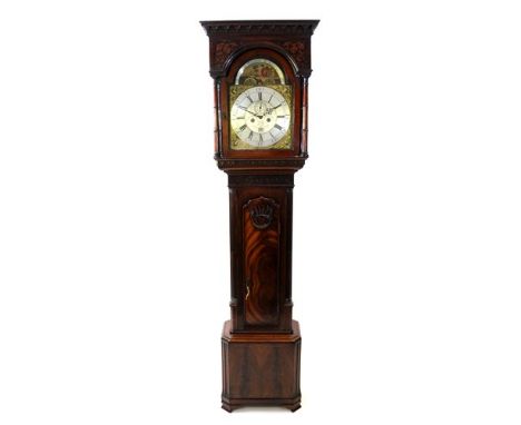 A George III mahogany cased longcase clock, the arch carved ogive cornice above foliate blind fretwork frieze and arched glaz