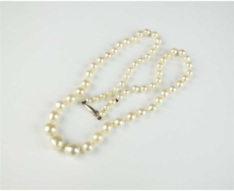 A untested graduated baroque pearl necklace, the pearls measure from approx 3mm to 7.5mm diameter, with white metal barrel sn