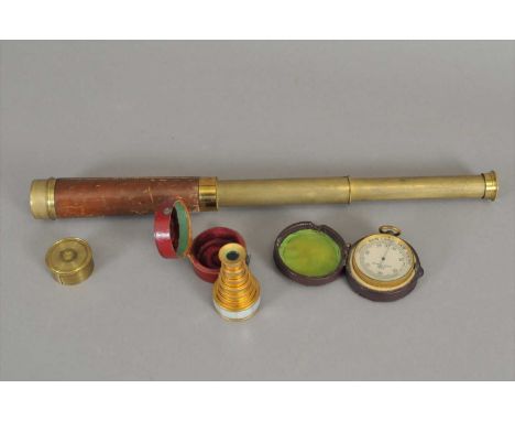 A cased pocket barometer by Negretti &amp; Zambra barometer, with a bevelled dial, named and numbered 15396 centrally, in a b