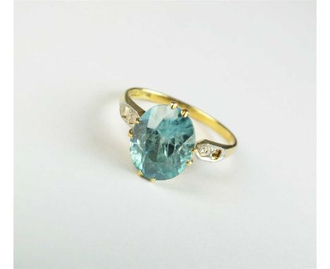 A blue zircon ring, designed as an oval mixed cut zircon claw set in yellow metal with rose cut diamond set shoulders, the ye