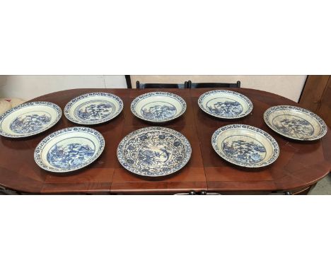 CHARGERS, a set of seven, 43cm diam. at largest, of differing sizes, and one other, Chinese Export style ceramic. (8) 