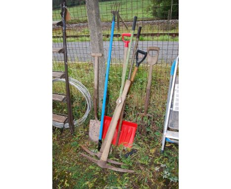 Two pick axes, snow shovel, spade and fork.