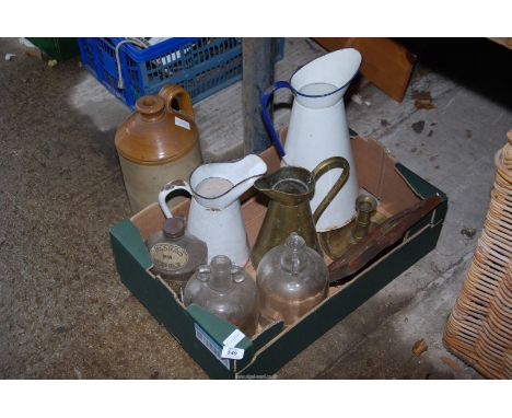 Enamel and brass jugs and demi-johns.